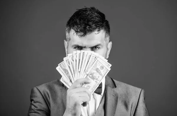 Get cash money easy and quickly. Smell of money. Easy cash loans. Man formal suit hold pile of dollar banknotes blue background. Businessman got cash money. Richness and wellbeing concept — Stock Photo, Image