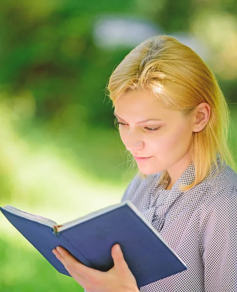 Reading inspiring books. Female literature. Relax leisure an hobby concept. Best self help books for women. Books every girl should read. Girl concentrated sit park read book nature background