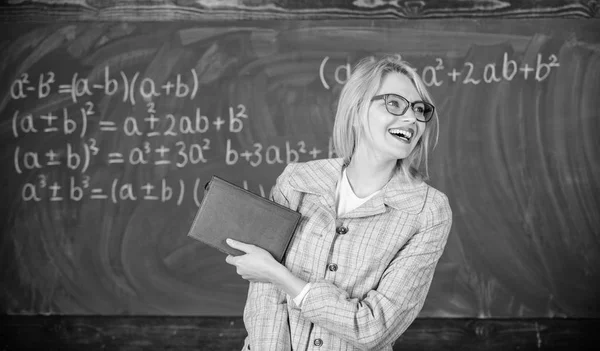 Woman smiling teacher hold book stand front chalkboard. Recommendation for college concept. Request letter recommendation teacher. Recommendation tips application. Great letter of recommendation — Stock Photo, Image