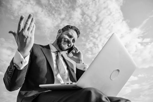 Sales manager responsibilities. Stay in touch. Man formal suit work with laptop while speak on phone. Businessman surfing internet while speaking to client. Ultimate guide to becoming sales leader