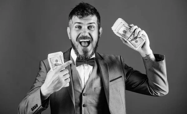 Get cash easy and quickly. Cash transaction business. Man happy winner rich hold pile of dollar banknotes blue background. Easy cash loans. Win lottery concept. Businessman got cash money — Stock Photo, Image