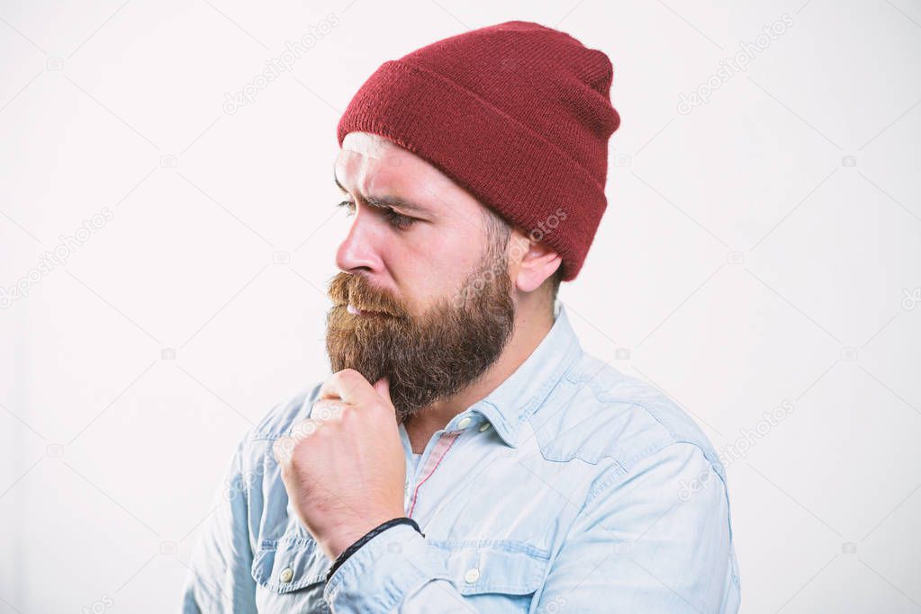 Bearded man posing confidently on white background. Barbershop concept. Man bearded with mustache brutal masculine appearance. Hipster style and fashion. Hipster bearded guy wear bright hat accessory