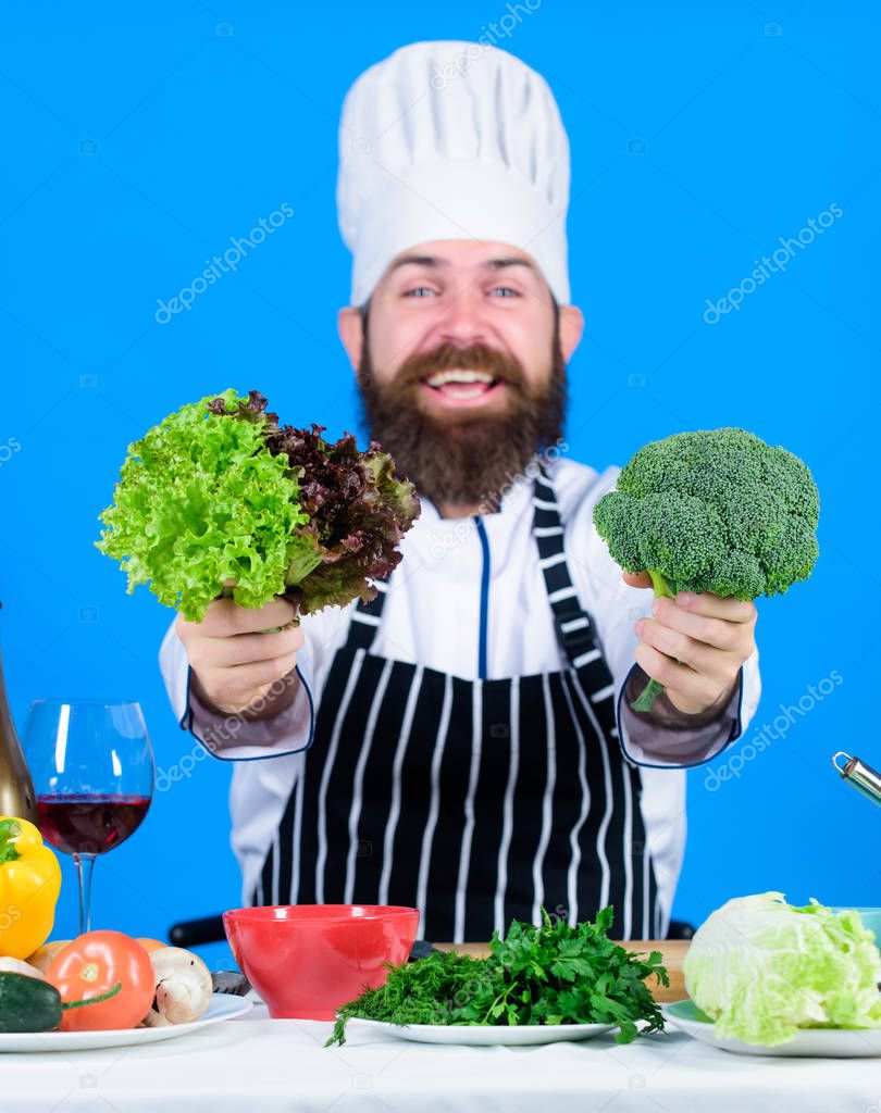 Vegetarian. Mature chef with beard. Healthy food cooking. Bearded man cook in kitchen, culinary. Dieting and organic food, vitamin. Chef man in hat. Secret taste recipe. Absolutely alike