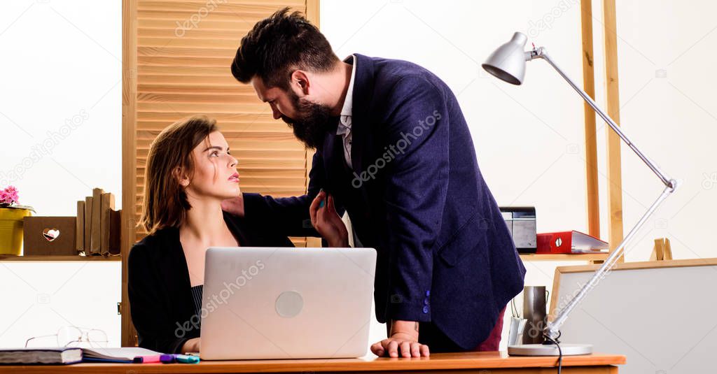 Flirting at workplace entirely unprofessional. Flirting and seduction. Flirting with coworker. Woman flirting with guy coworker. Woman attractive lady with man colleague. Office collective concept