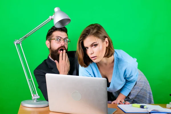 love affair at work. Seduction. business couple at computer. woman and man work in office at laptop. secretary with boss at workplace. businessman and assistant solve problem. Working on new tablet