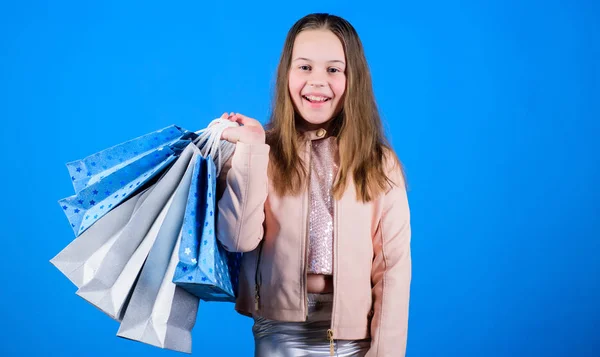 Happy child in shop with bags. Shopping day happiness. Buy clothes. Fashionista addicted buyer. Fashion boutique kids. Birthday girl shopping. Shopping is best therapy. Black friday best deals — Stock Photo, Image