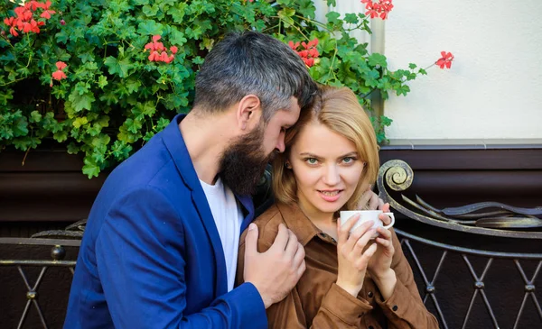 Feeling sensual. Morning coffee. Couple in love on romantic date. woman and man with beard relax in cafe. First meet of girl and mature man. bearded hipster and girl drink coffee. Extremely sensual