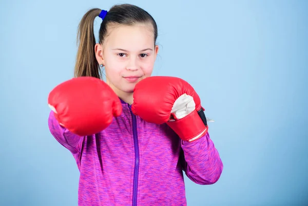 Best exercise. Fitness diet. energy health. workout of small girl boxer. Sport success. sportswear fashion. punching knockout. Childhood activity. Happy child sportsman in boxing gloves