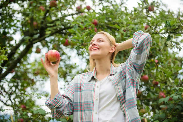 stock image vitamin and dieting food. healthy teeth. hunger. orchard, gardener girl in apple garden. Happy woman eating apple. spring harvest. summer fruit. strong teeth. useful apple. i love apples. fresh apple