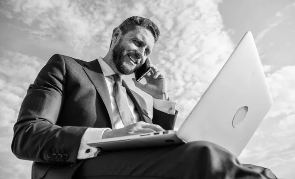 Sales manager responsibilities. Ultimate guide to becoming sales leader. Stay in touch. Man formal suit work with laptop while speak on phone. Businessman surfing internet while speaking to client