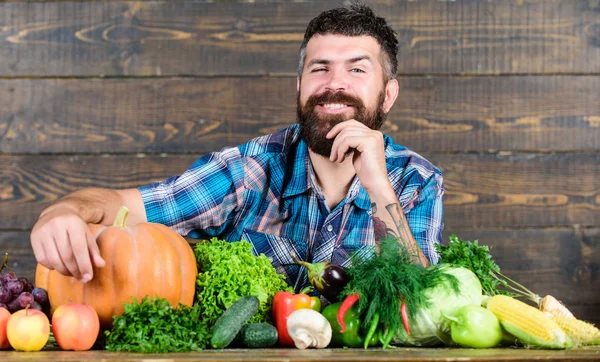 harvest festival. seasonal vitamin food. Useful fruit and vegetable. man chef with rich autumn crop. organic and natural food. happy halloween. bearded mature farmer. harvest festival concept