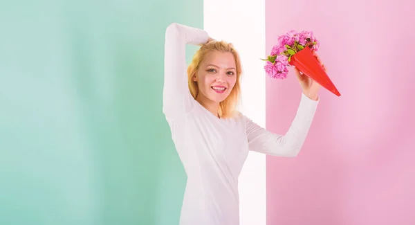 Lady happy received favorite flowers as gift. Bouquet equal happiness. Woman smiling likes to receive bouquet surprise. Her favorite flowers. Girl holding bouquet flowers enjoy favorite fragrance