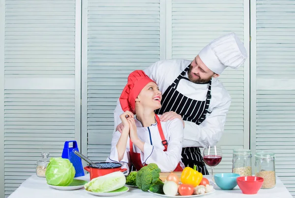 Ultimate cooking challenge. Couple compete in culinary arts. Reasons why couples cooking together. Cooking with your spouse can strengthen relationships. Woman and bearded man culinary partners