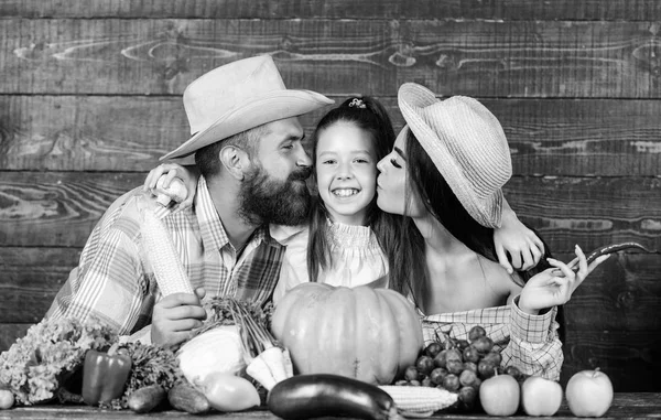 Family rustic style farmers at market with vegetables fruits and greenery. Parents and daughter harvest festival. Family farm concept. Family farmers with harvest wooden background. Grown with love — Stock Photo, Image