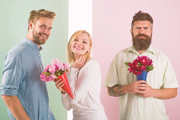 Girl smiling made her choice. Girl popular receive lot male attention. Woman happy takes bouquet flowers romantic gift. Broken heart concept. Men competitors with bouquets flowers try conquer girl — Stock Photo, Image