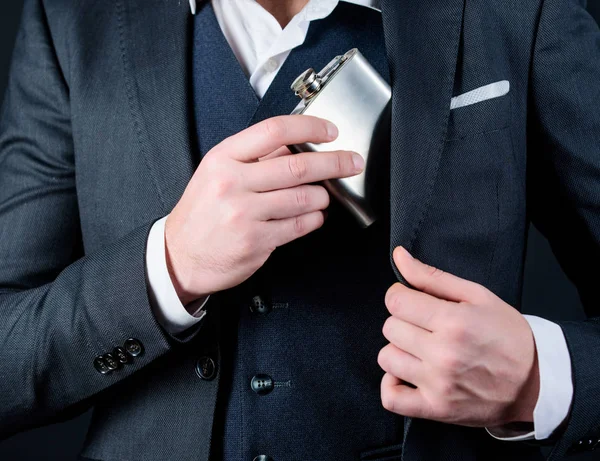 Alcohol abuse of man has bad addiction. bachelor and single. businessman in suit. concept of alcohol abuse. male with beard put flask in pocket. male drink alcohol. alcohol abuse. hangover — Stock Photo, Image