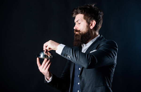 Best chef ever. Mature hipster with beard hold food tray in restaurant. brutal caucasian hipster hold metallic dish. businessman in suit. Waiter man. Perfect recipe. Bearded man chef presenting meal