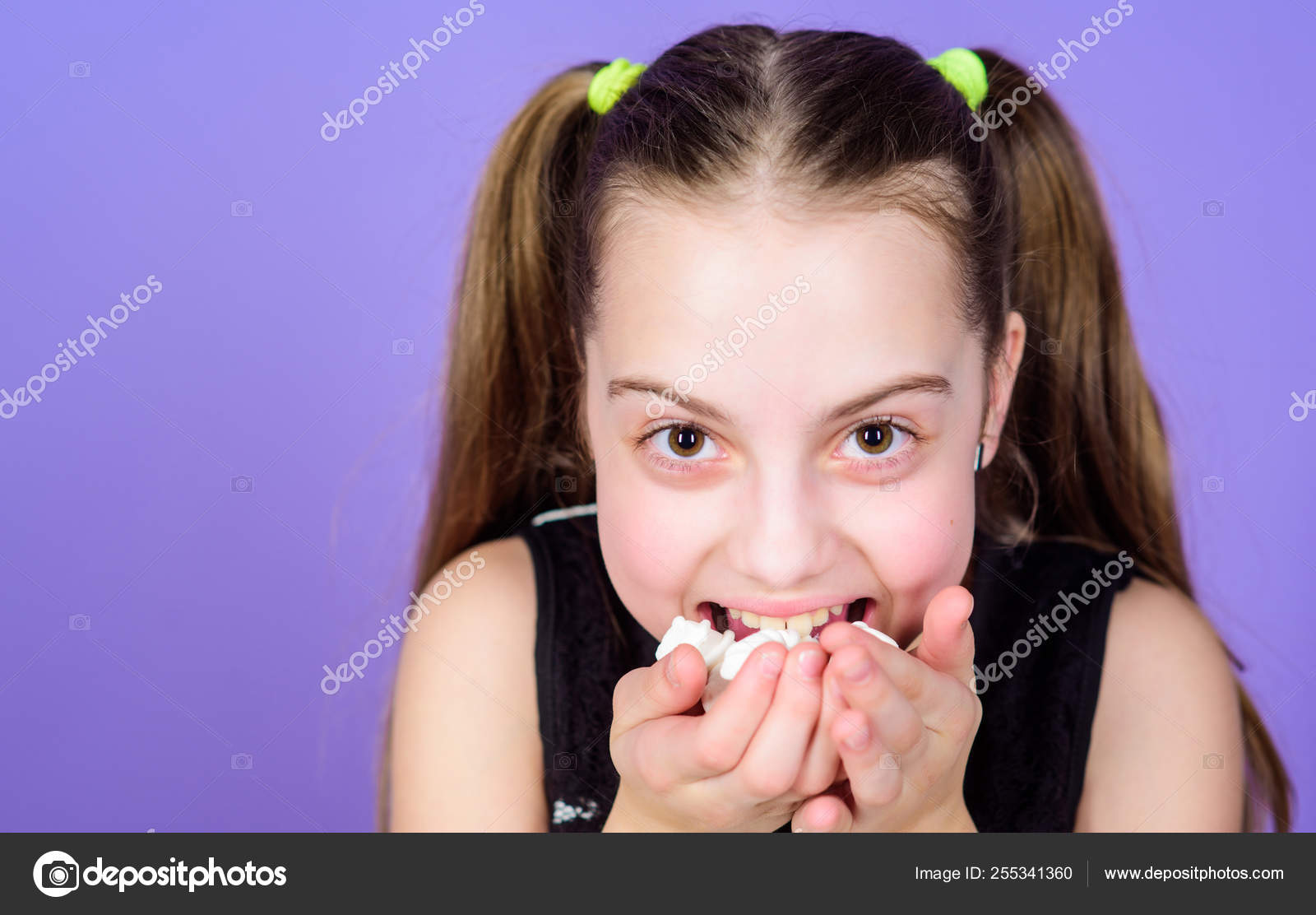 Incorrigible Sweet Tooth Girl Smiling Face Holds Sweet Marshmallows In Hand Violet Background Sweet Tooth Concept Kid Girl With Long Hair Likes Sweets And Treats Calorie And Diet Hungry Kid Stock
