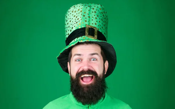 Feeling lucky. Happy irish man with beard smiling in green wear. Happy saint patricks day. Bearded man celebrating saint patricks day. Hipster in leprechaun hat and costume