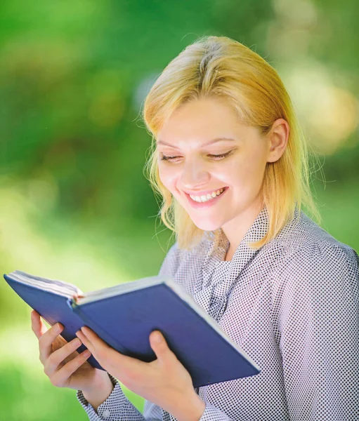 Reading inspiring books. Female literature. Relax leisure an hobby concept. Best self help books for women. Books every girl should read. Girl interested sit park read book nature background