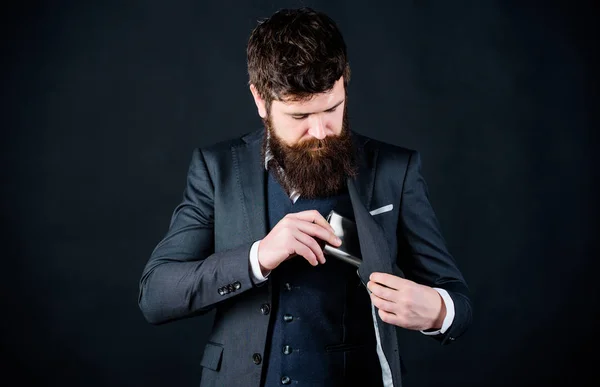 Bearded man bachelor drink alcohol. bachelor and single. brutal caucasian hipster has bad addiction. businessman in suit. Mature hipster bachelor with beard put flask in pocket. unhealthy and bad — Stock Photo, Image