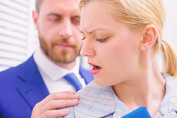 Businessman Sexually Harassing Female Colleague. Protection female rights. Touch knee.