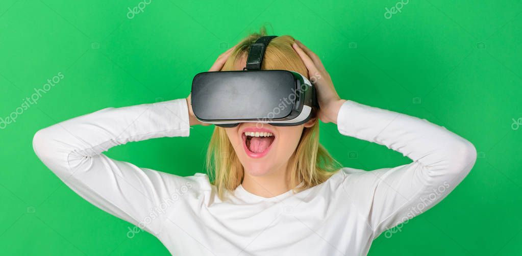 Young woman using a virtual reality headset with conceptual network lines. Excited smiling businesswoman wearing virtual reality glasses. Woman wearing virtual reality goggles in green background.