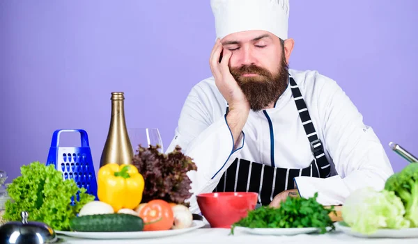 Bored chef lean on table at kitchen. Culinary inspiration. Hard day at restaurant. Tired and exhausted chef. Man bearded chef cooking food. Chef fed up of boring meals. Looking for inspiration — Stock Photo, Image