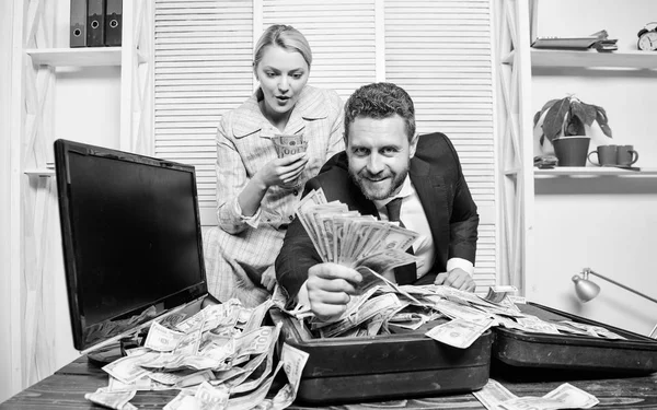 Financial success. Man businessman and woman secretary with pile dollar banknotes. Profit and richness concept. Businessman near cash dollars profit. Huge profit concept. Counting money profit — Stock Photo, Image