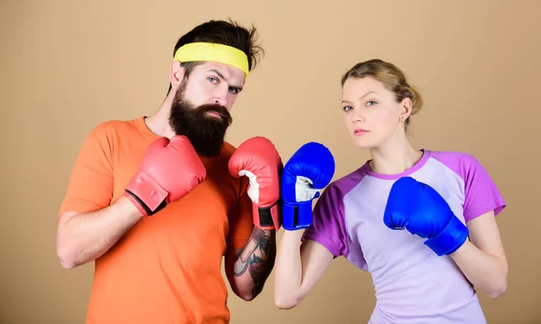 One spirit, one team, one win. punching, sport Success. sportswear. Fight. training with coach. Happy woman and bearded man workout in gym. knockout and energy. couple training in boxing gloves — Stock Photo, Image