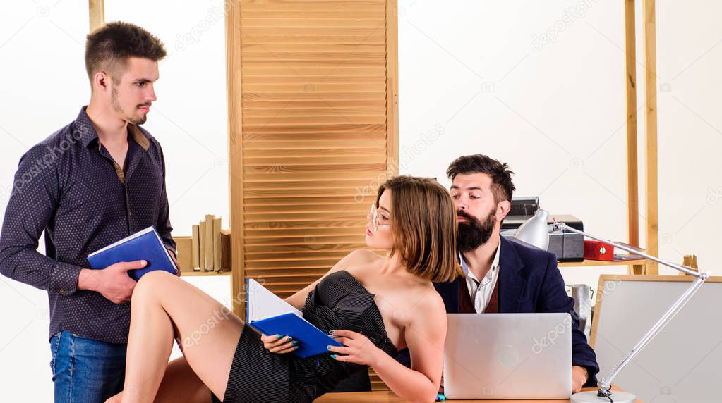 Conducting a meeting to discuss a new business plan. Business persons writing meeting report notes. People making great business discussion in meeting room. Managers leading informal business meeting