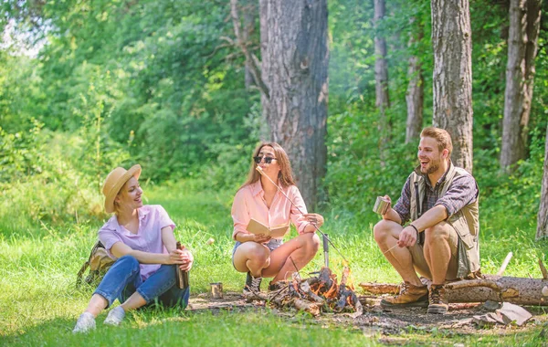 Take a break to have snack. Company hikers at picnic roasting marshmallows snacks. Company friends prepare roasted marshmallows snack nature background. Hikers traditions. Spend great time on weekend — Stock Photo, Image