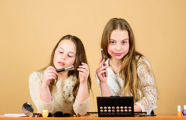 Makeup art. Explore cosmetics bag concept. Salon and beauty treatment. Just like playing with makeup. Makeup courses. Children little girls choose cosmetics. Makeup store. Experimenting with style