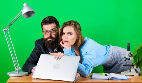 Sealing a deal. sexy woman and man work in office at laptop. corporate ethics. businessman and assistant. love affair at work. Seduction. business couple at computer. secretary with boss at workplace — Stock Photo, Image