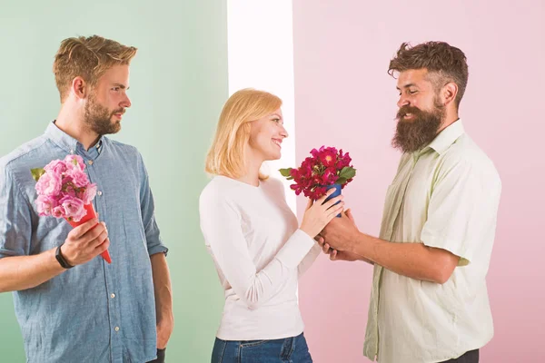 Men competitors with bouquets flowers try conquer girl. Girl smiling made her choice. Broken heart concept. Woman happy takes bouquet flowers romantic gift. Girl popular receive lot male attention — Stock Photo, Image