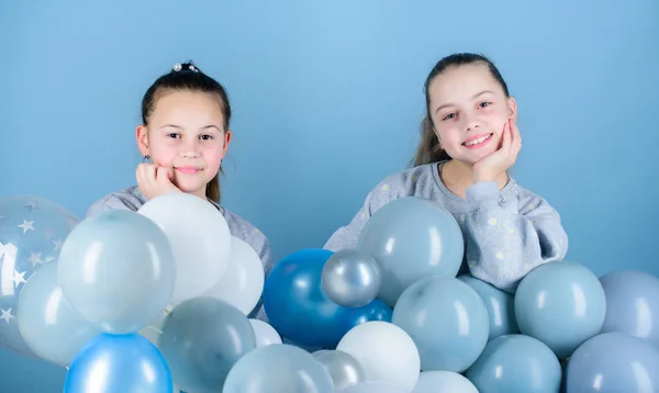 Happiness and cheerful moments. Carefree childhood. Sisters organize home party. Having fun concept. Balloon theme party. Girls best friends near air balloons. Start this party. Birthday party