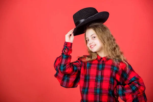 Fashion trend. Feeling awesome in this hat. Girl cute kid wear fashionable hat. Small fashionista. Cool cutie fashionable outfit. Happy childhood. Kids fashion concept. Check out my fashion style