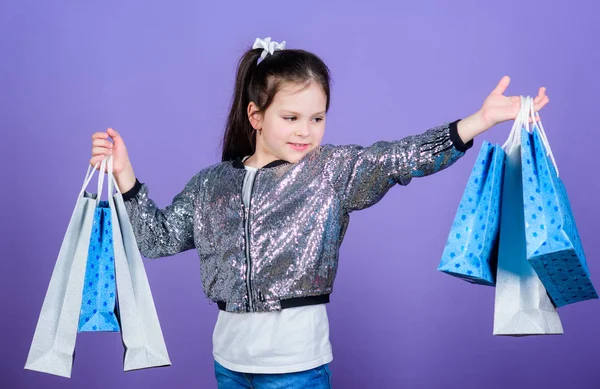 wow. super sale. Happy child. Little girl with gifts. Small girl with shopping bags. special offer. Holiday purchase saving. Sales discounts. Kid fashion. shop assistant. wow, look what i got