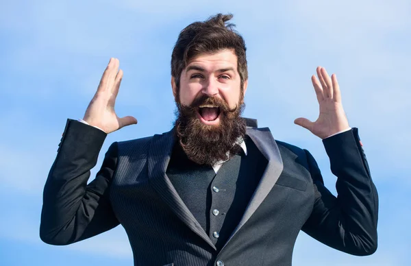 Success and luck. Optimistic mood. Think like optimist. Being optimistic. Hopeful and confident about future. Unexpected luck. Man bearded optimistic businessman wear formal suit sky background