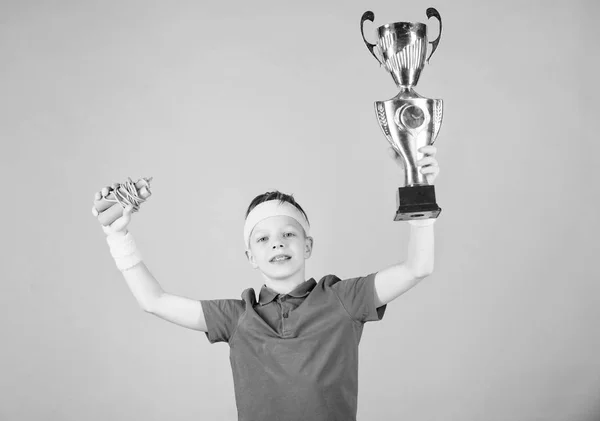 Sport and health. Gold prize. Gym workout of teen boy. success. Childhood activity. Fitness and diet. Energy. Happy child sportsman hold prize cup. prize winner. Feeling free and confident