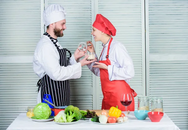 dieting concept. man and woman chef in restaurant. happy couple in love with healthy food doeting. Dieting and vitamin. culinary cuisine. vegetarian. cook uniform. Family cooking in kitchen. diet