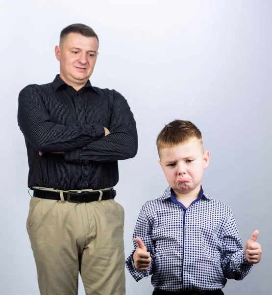 unsatisfied with work done. childhood. trust and values. fathers day. father and son in business suit. fashion. happy child with father. business partner. small boy with dad businessman. family day