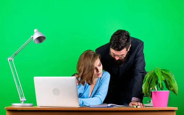 secretary with boss at workplace. businessman and assistant solve problem. data and information. Team brainstorming. business couple at computer. woman and man work in office at laptop. Team at work