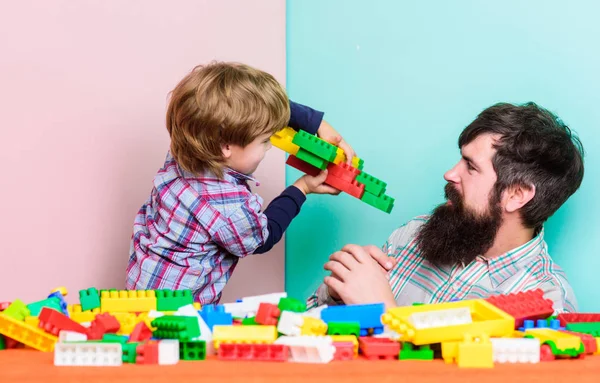 Free time. love. child development. father and son play game. Dream about fly. happy family leisure. small boy with dad playing together. building plane with colorful constructor. You are my treasure