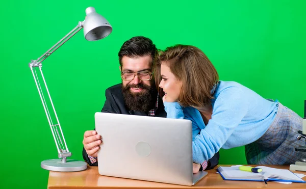 So happy. business couple at computer. businessman and assistant solve problem. woman and man work in office at laptop. love affair at work. Seduction. secretary with boss at workplace