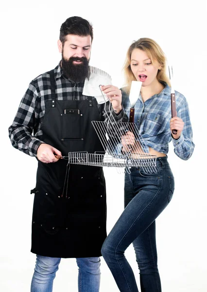 Good for barbecue. Bearded man and pretty woman holding grilling grate. Happy couple having grill grid for grilling. Grilling is a healthy way of cooking food. Family gathering with grilling mangal — Stock Photo, Image