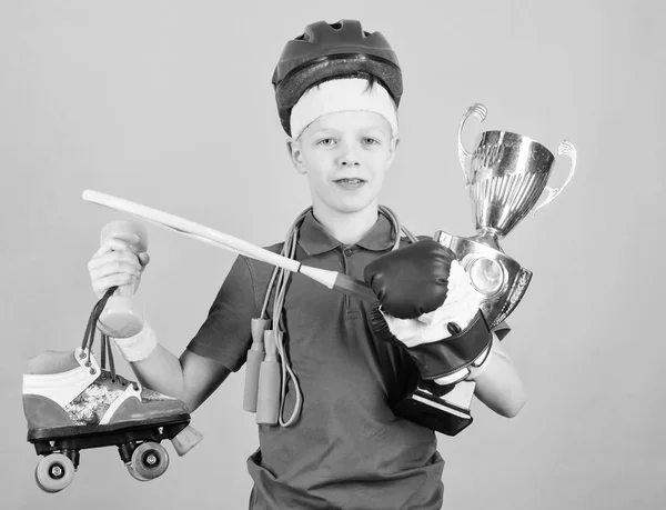 Athlete successful boy sport equipment jump rope boxing glove tennis racket roller skate and golden goblet. Success and award. Success in sport. Proud of achieved success. Succeed in everything