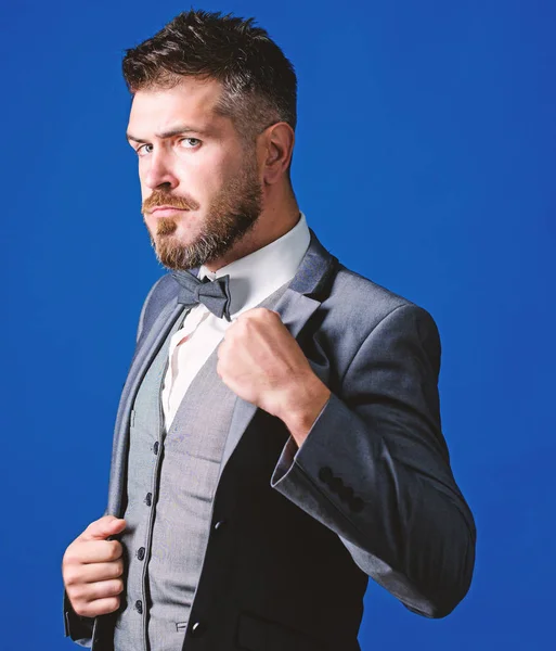 Classic style aesthetic. Perfect suit fit him. Menswear shop. Man adjust suit with bow tie. Well groomed man with beard in formal suit jacket. Male fashion and aesthetic. Businessman formal outfit