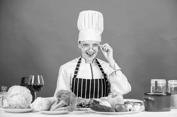 Culinary education. Culinary expert. Woman chef cooking healthy food. Fresh vegetables ingredients for cooking meal. Culinary school concept. Female in apron knows everything about culinary art