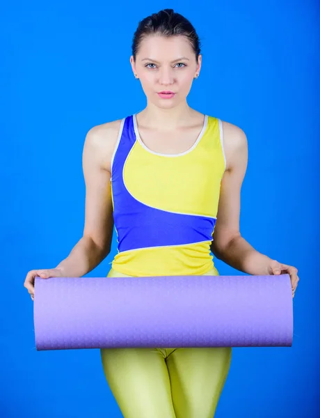 Stretching away the stress. Sporty woman training in gym. Sport mat equipment. Athletic fitness. Happy woman workout with fitness mat. Strong muscles and power. Health diet. Success. stress away